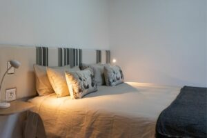 Premium bed layout with crisp linens and elegant styling in Room 3 at Views Over Wilderness guesthouse.