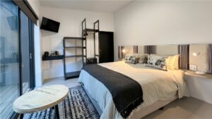 Full interior bedroom view showcasing the spacious layout and elegant decor of Room 2 at Views Over Wilderness guesthouse.